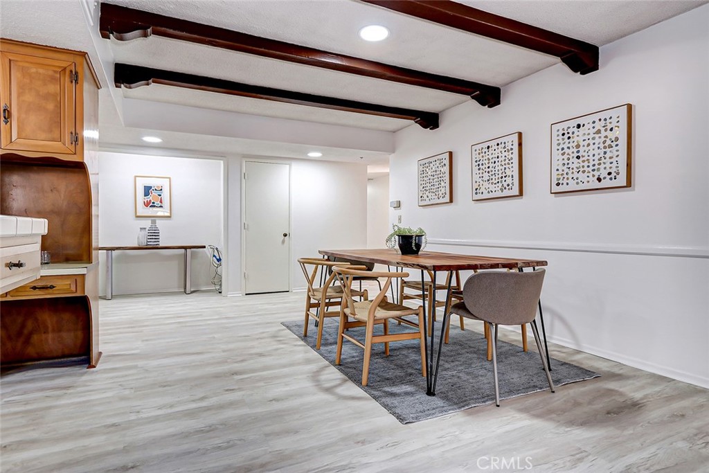 2861 Channing Way Rossmoor, CA 90720 - Photo 9 of 39 a view of a dining room with furniture and wooden floor