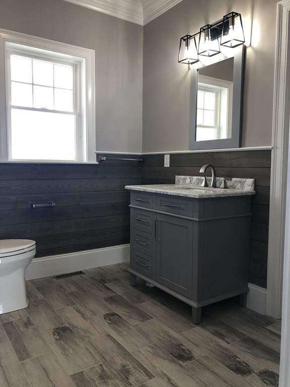 70 Surfside Road Scituate, MA 02066 - Photo 12 of 32 a bathroom with a sink mirror and toilet