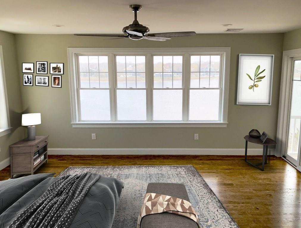 70 Surfside Road Scituate, MA 02066 - Photo 14 of 32 a living room with a bed furniture and a large window