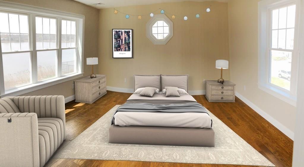 70 Surfside Road Scituate, MA 02066 - Photo 17 of 32 a spacious bedroom with a bed and window