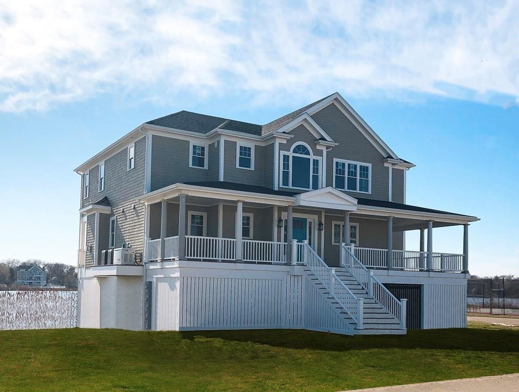 70 Surfside Road Scituate, MA 02066 - Photo 3 of 32 a front view of a house with a garden and lake view
