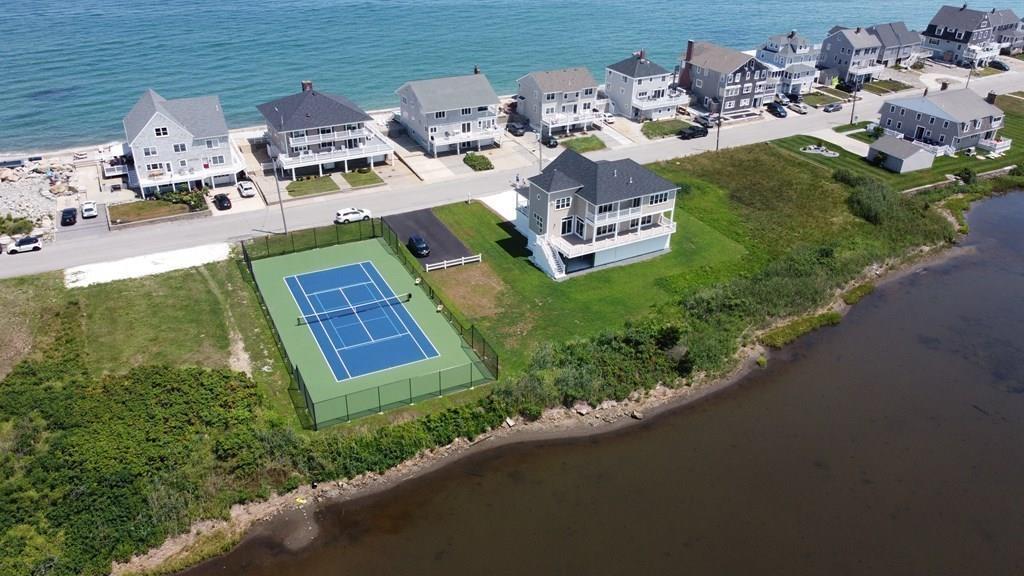 70 Surfside Road Scituate, MA 02066 - Photo 31 of 32 an aerial view of a house with a garden and lake view