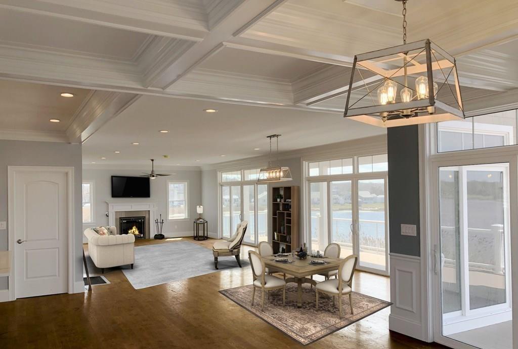 70 Surfside Road Scituate, MA 02066 - Photo 8 of 32 a living room with furniture a flat screen tv and a chandelier