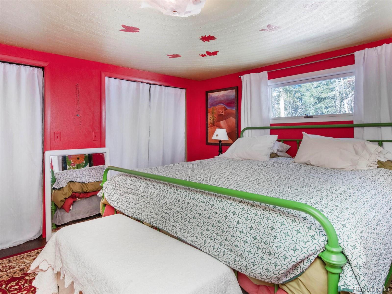 3135 Riverside Drive Lyons, CO 80540 - Photo 20 of 37 a bedroom with a bed and window