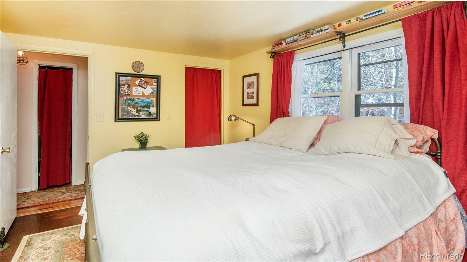 3135 Riverside Drive Lyons, CO 80540 - Photo 23 of 37 a bedroom with a bed and a window
