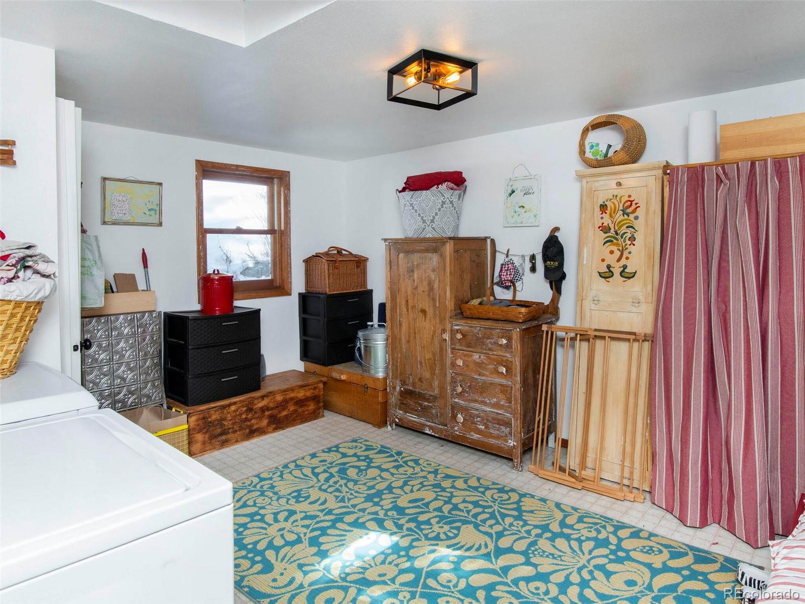 3135 Riverside Drive Lyons, CO 80540 - Photo 25 of 37 a bedroom with furniture and window
