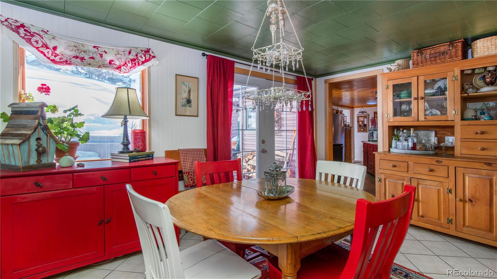 3135 Riverside Drive Lyons, CO 80540 - Photo 8 of 37 a dining room with furniture a chandelier and window