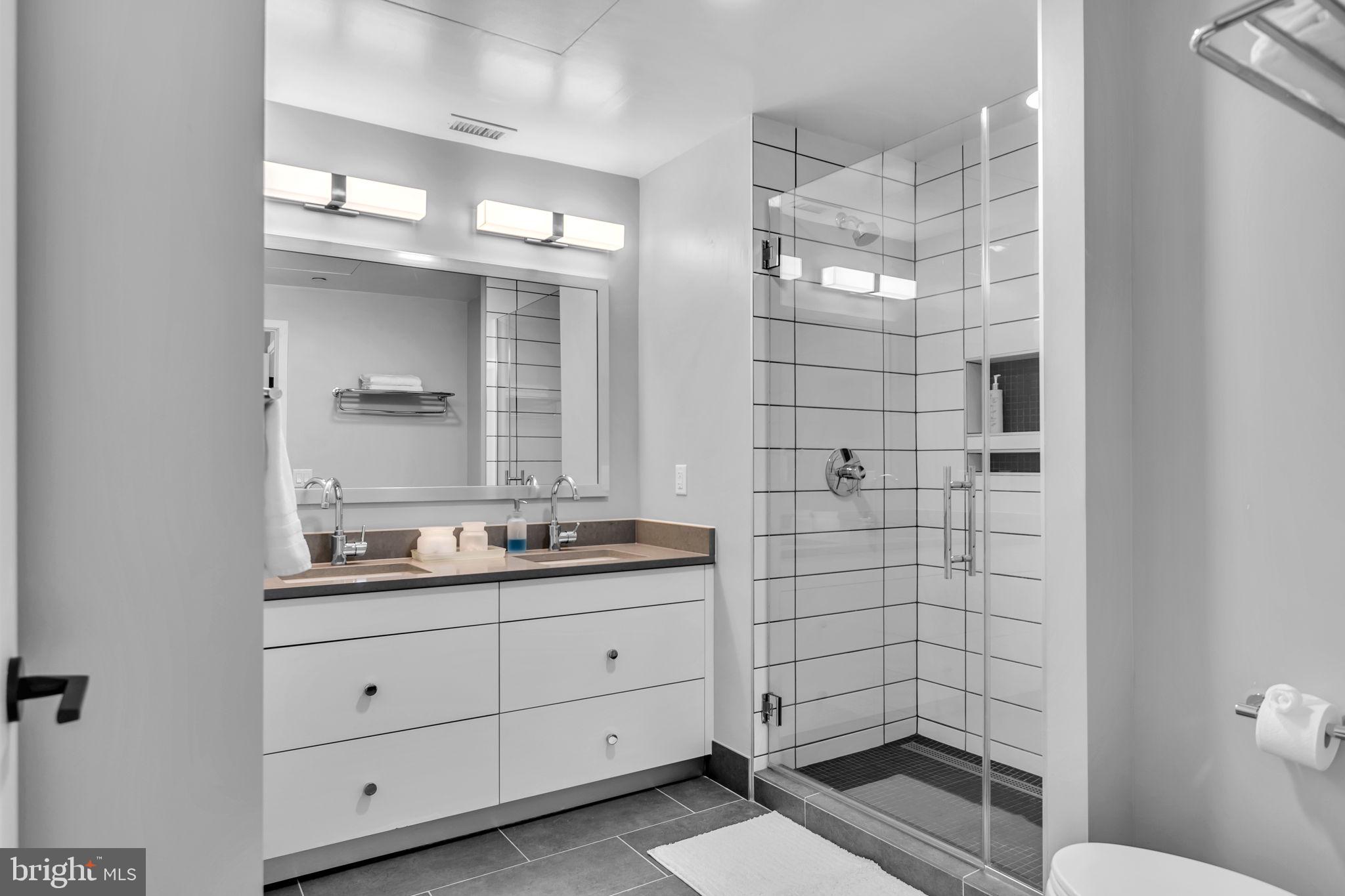 1300 4th Street Southeast, Unit PH2 Washington, DC 20003 - Photo 52 of 60 Large guest bath with dual sinks.