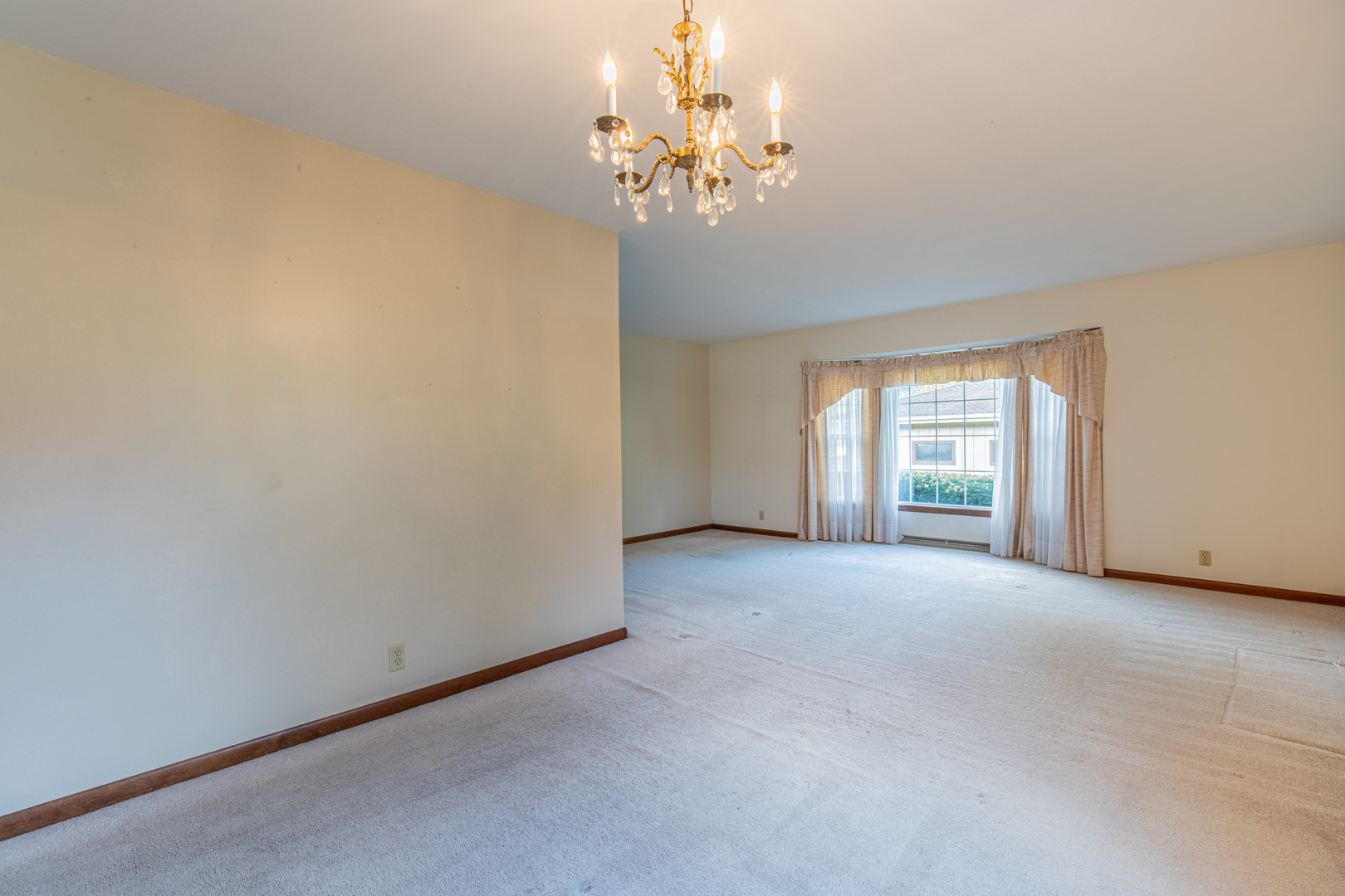 1403 Timothee Lane Mendota, IL 61342 - Photo 13 of 28 a view of a big room with windows and chandelier