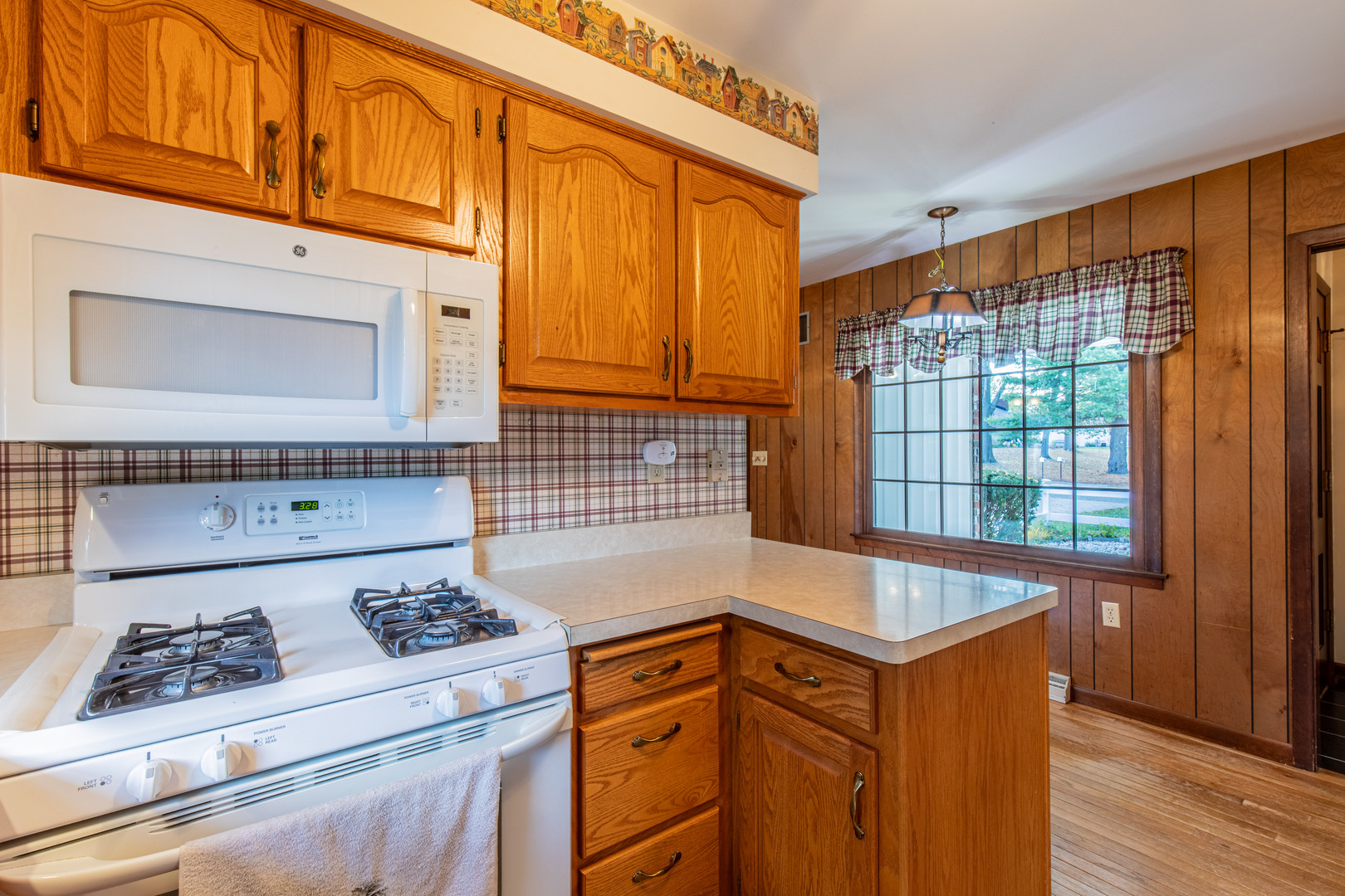 1403 Timothee Lane Mendota, IL 61342 - Photo 8 of 28 a kitchen with granite countertop cabinets and a stove top oven