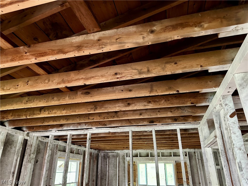5319 Fairtree Road Bedford Heights, OH 44146 - Photo 14 of 27 Exposed wood joists and wood plank ceiling, with partial wall framing and windows visible