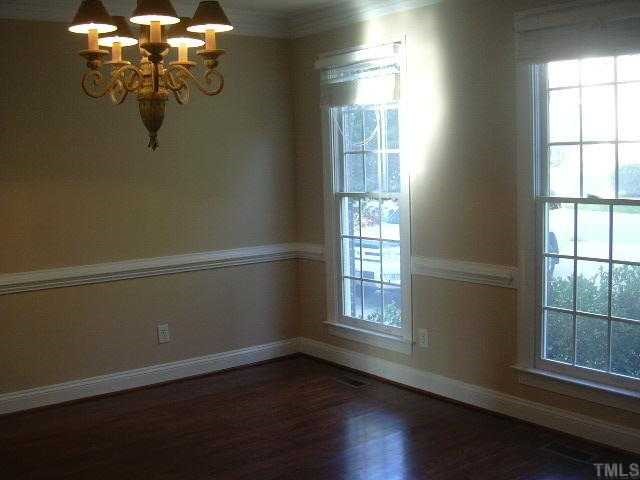 9420 Stone Mountain Road Raleigh, NC 27613 - Photo 3 of 12 a view of wooden door and windows in a room