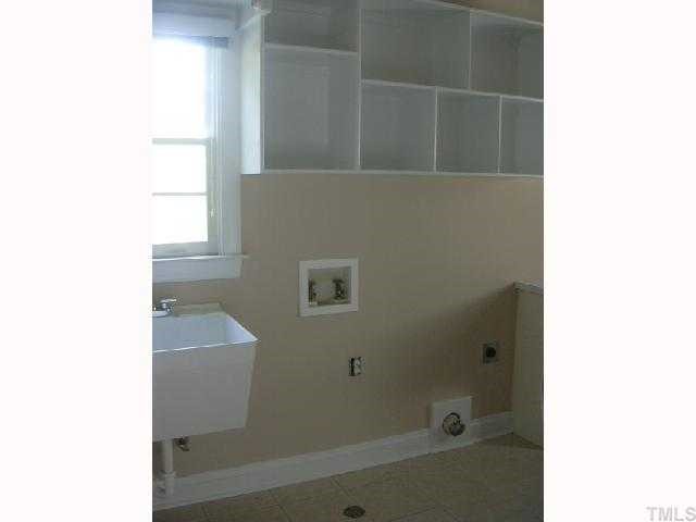 9420 Stone Mountain Road Raleigh, NC 27613 - Photo 7 of 12 a bathroom with a bathtub