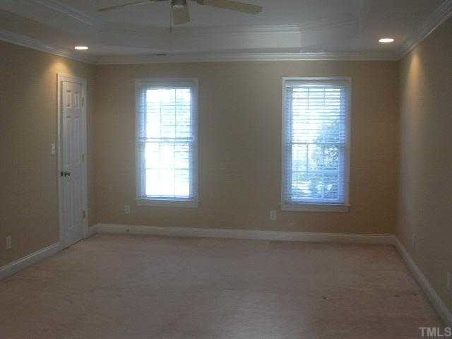 9420 Stone Mountain Road Raleigh, NC 27613 - Photo 8 of 12 an empty room with a window