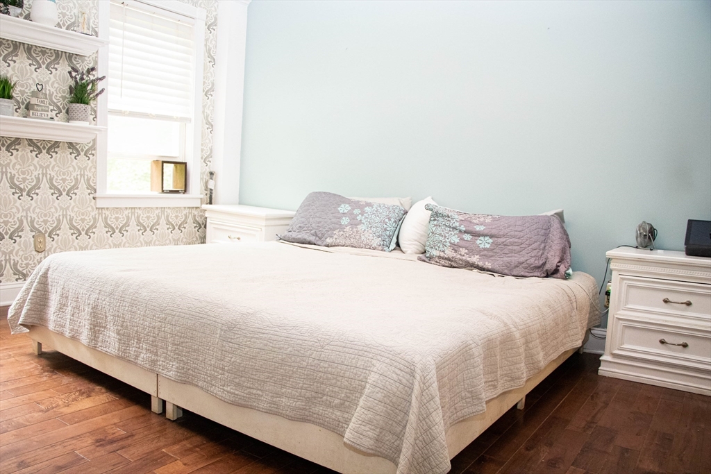 85-87 Slater Street Webster, MA 01570 - Photo 35 of 41 a bedroom with a bed and a window