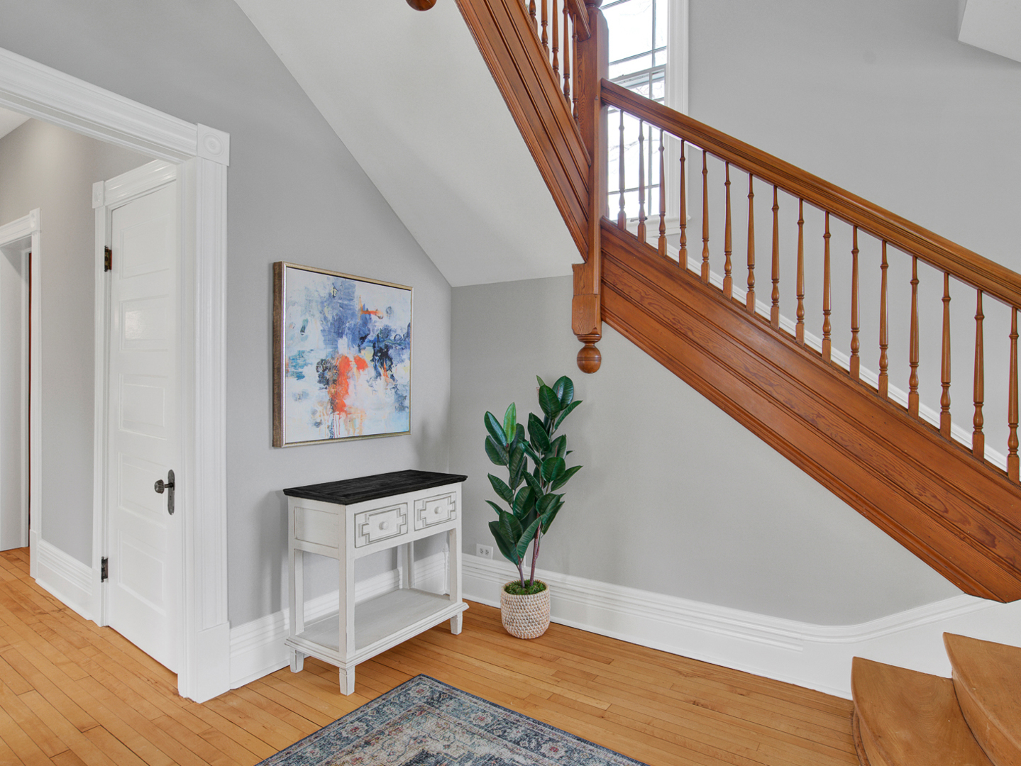 22 Orchard Place Hinsdale, IL 60521 - Photo 11 of 34 a view of staircase with wooden floor and a potted plant