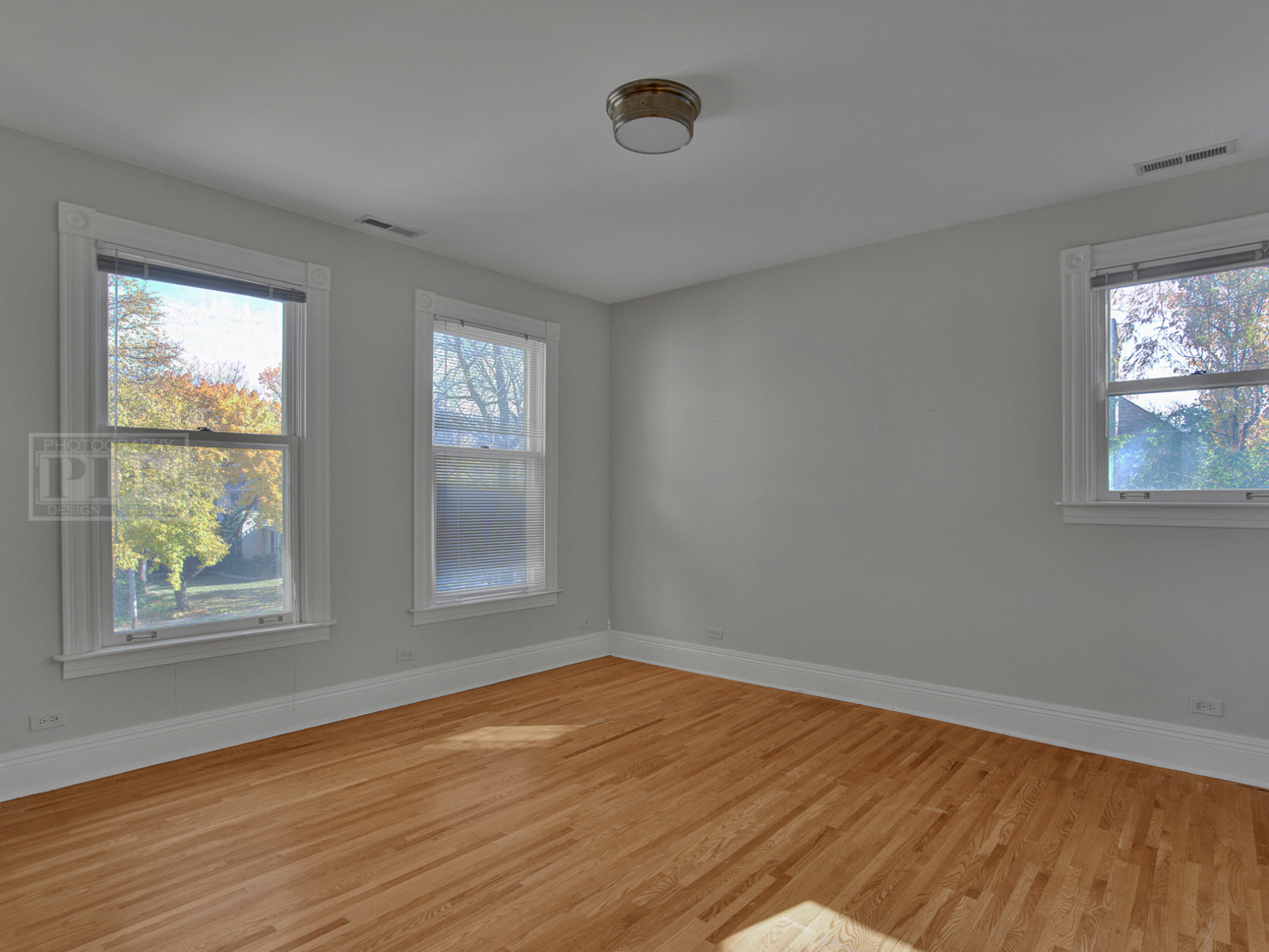 22 Orchard Place Hinsdale, IL 60521 - Photo 27 of 34 a view of empty room with wooden floor and fan