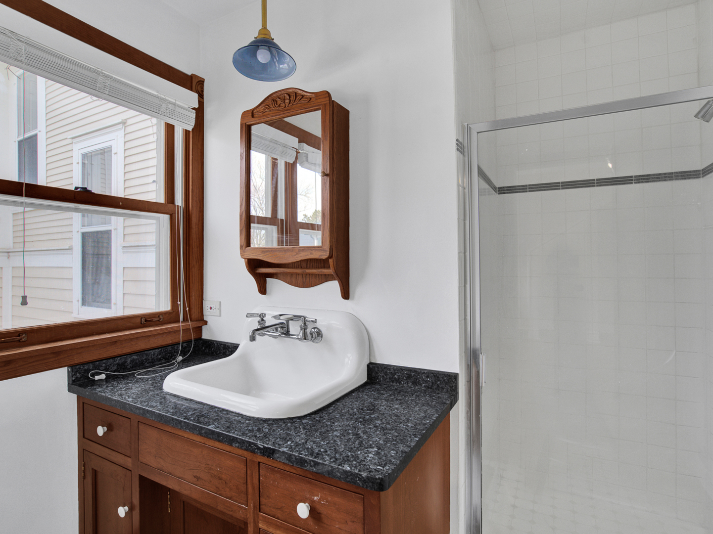 22 Orchard Place Hinsdale, IL 60521 - Photo 34 of 34 a bathroom with a granite countertop sink and a mirror