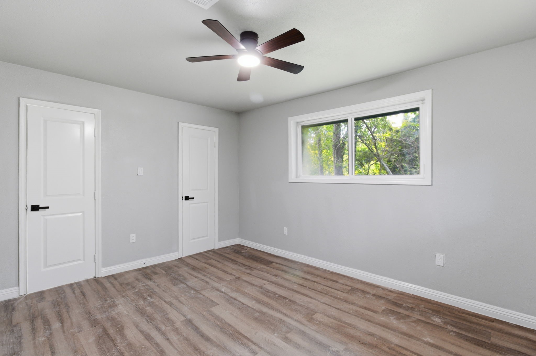 1910 Riverwood Trail Spring, TX 77386 - Photo 6 of 11 an empty room with wooden floor and windows