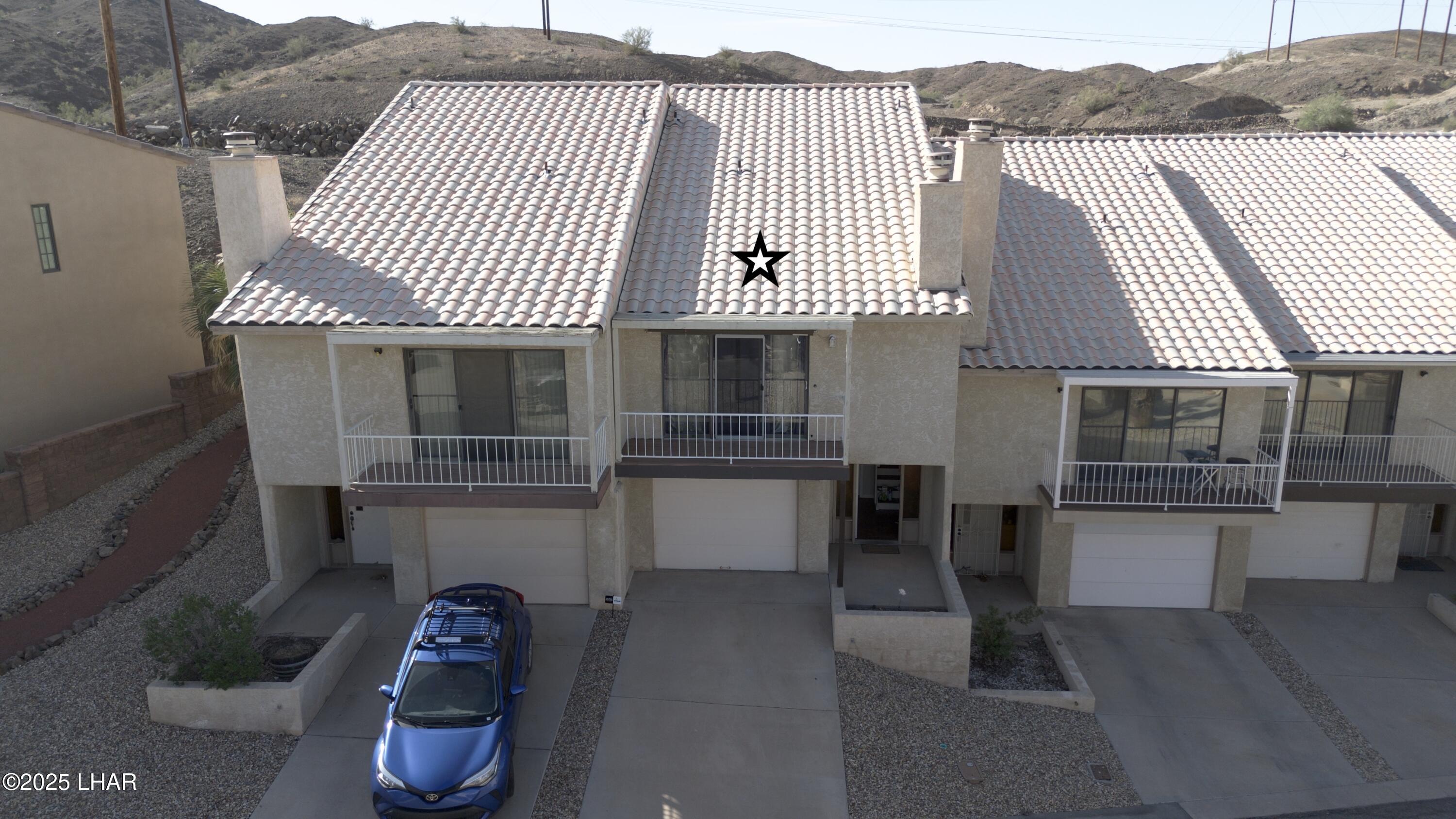 8625 Riverside Drive, Unit 38 Parker, AZ 85344 - Photo 1 of 48 a front view of a house with a garden