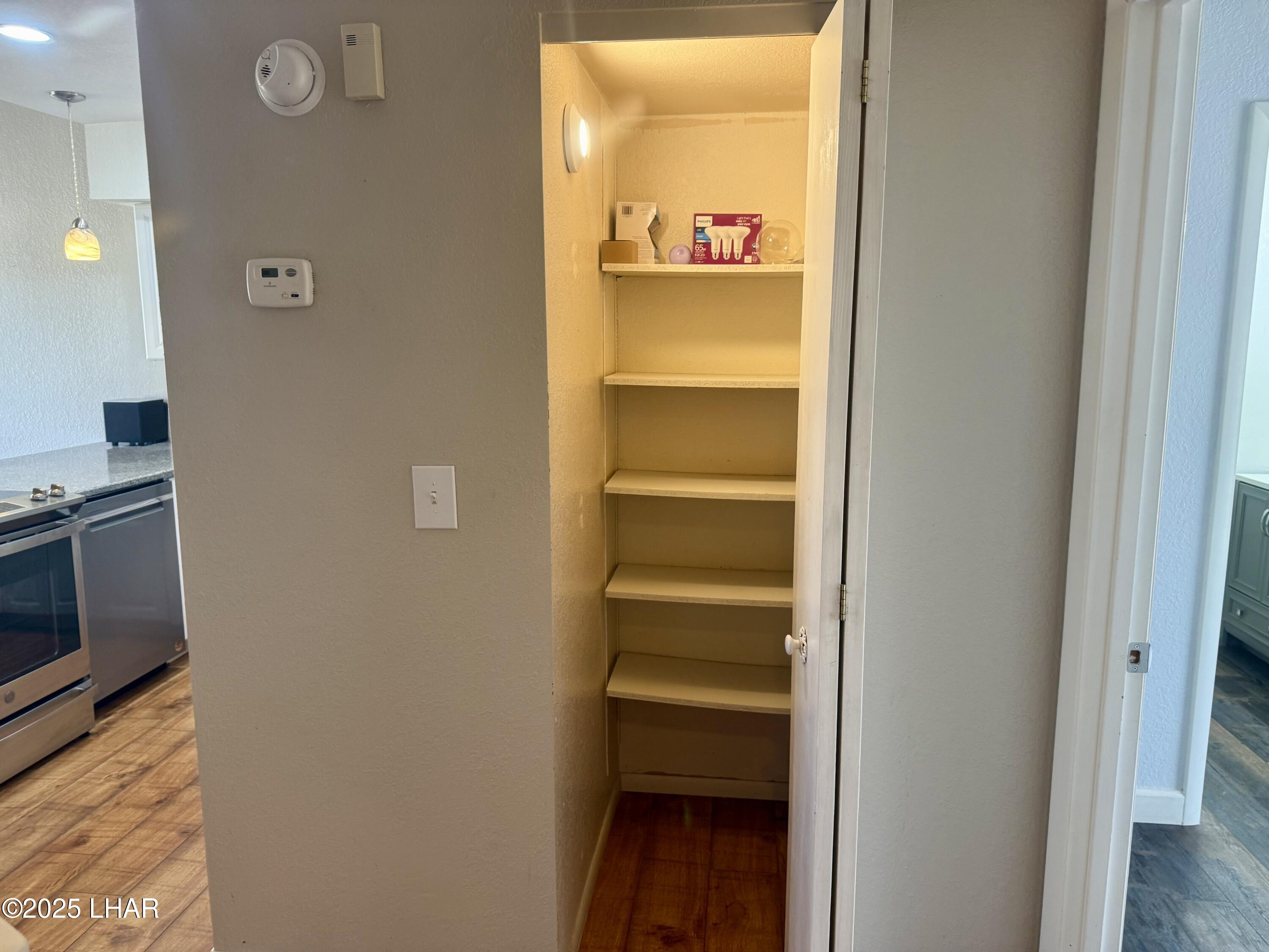 8625 Riverside Drive, Unit 38 Parker, AZ 85344 - Photo 15 of 48 a view of an entryway with wooden floor