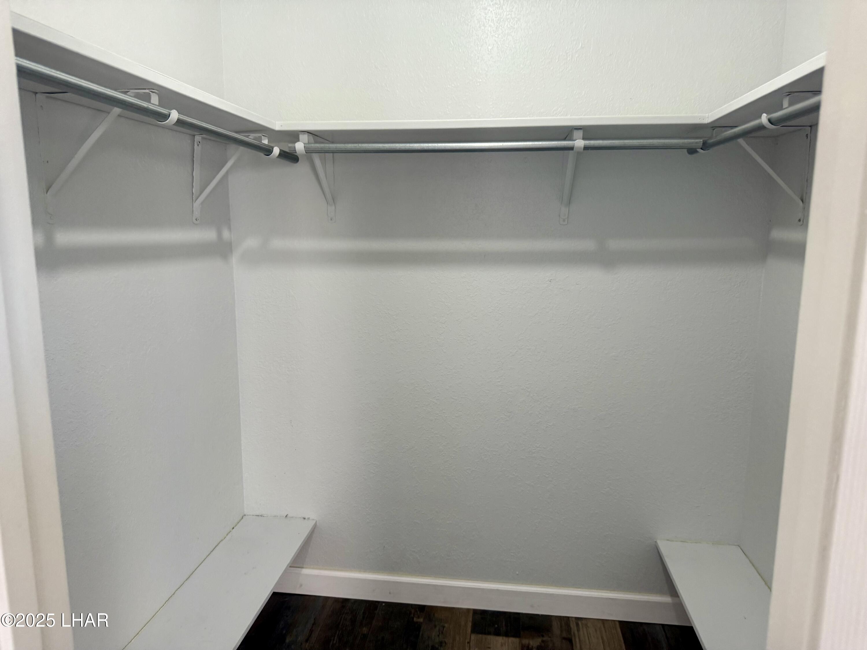 8625 Riverside Drive, Unit 38 Parker, AZ 85344 - Photo 21 of 48 a view of walk in closet with empty racks