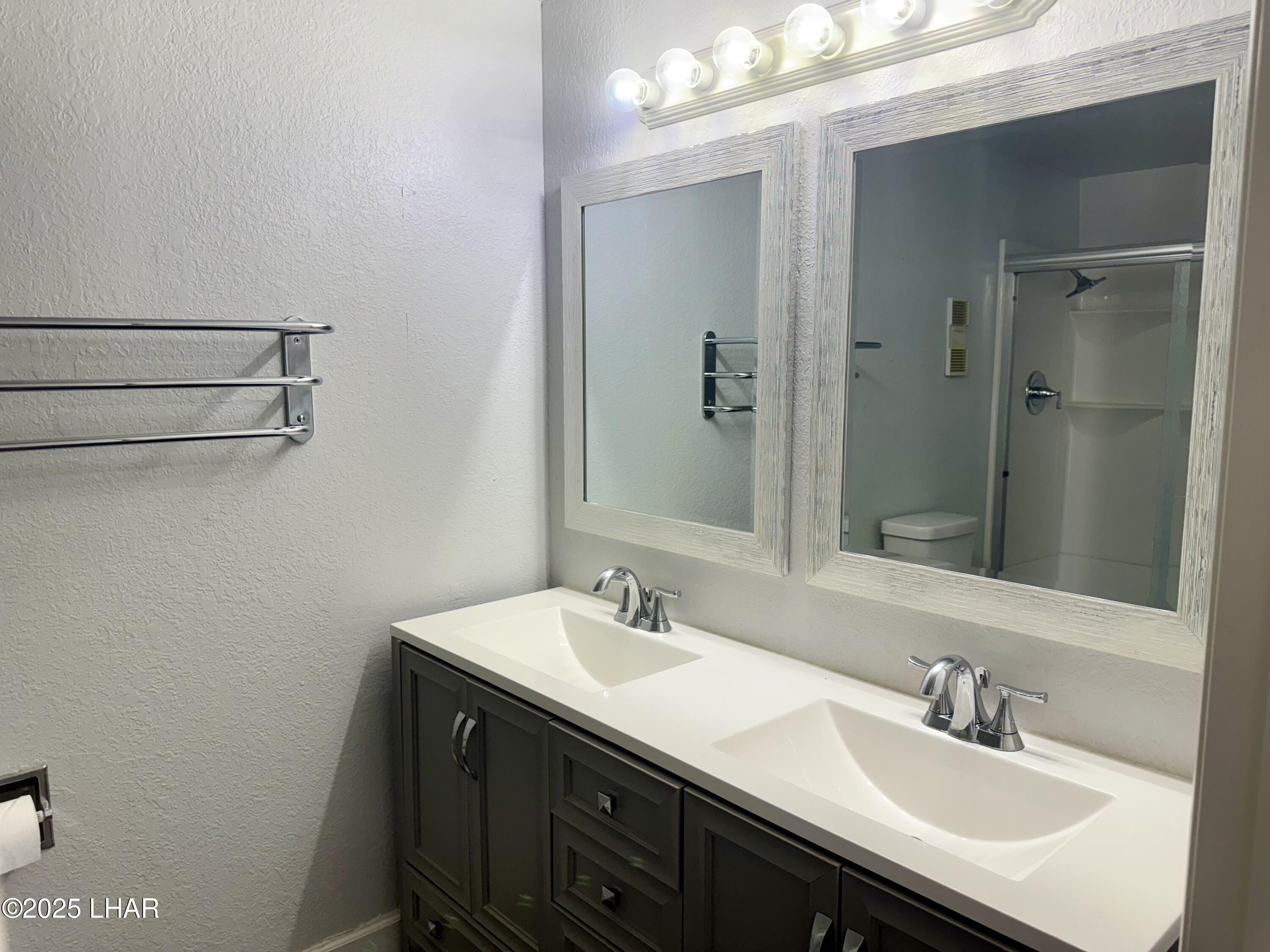 8625 Riverside Drive, Unit 38 Parker, AZ 85344 - Photo 22 of 48 a bathroom with a sink and a mirror