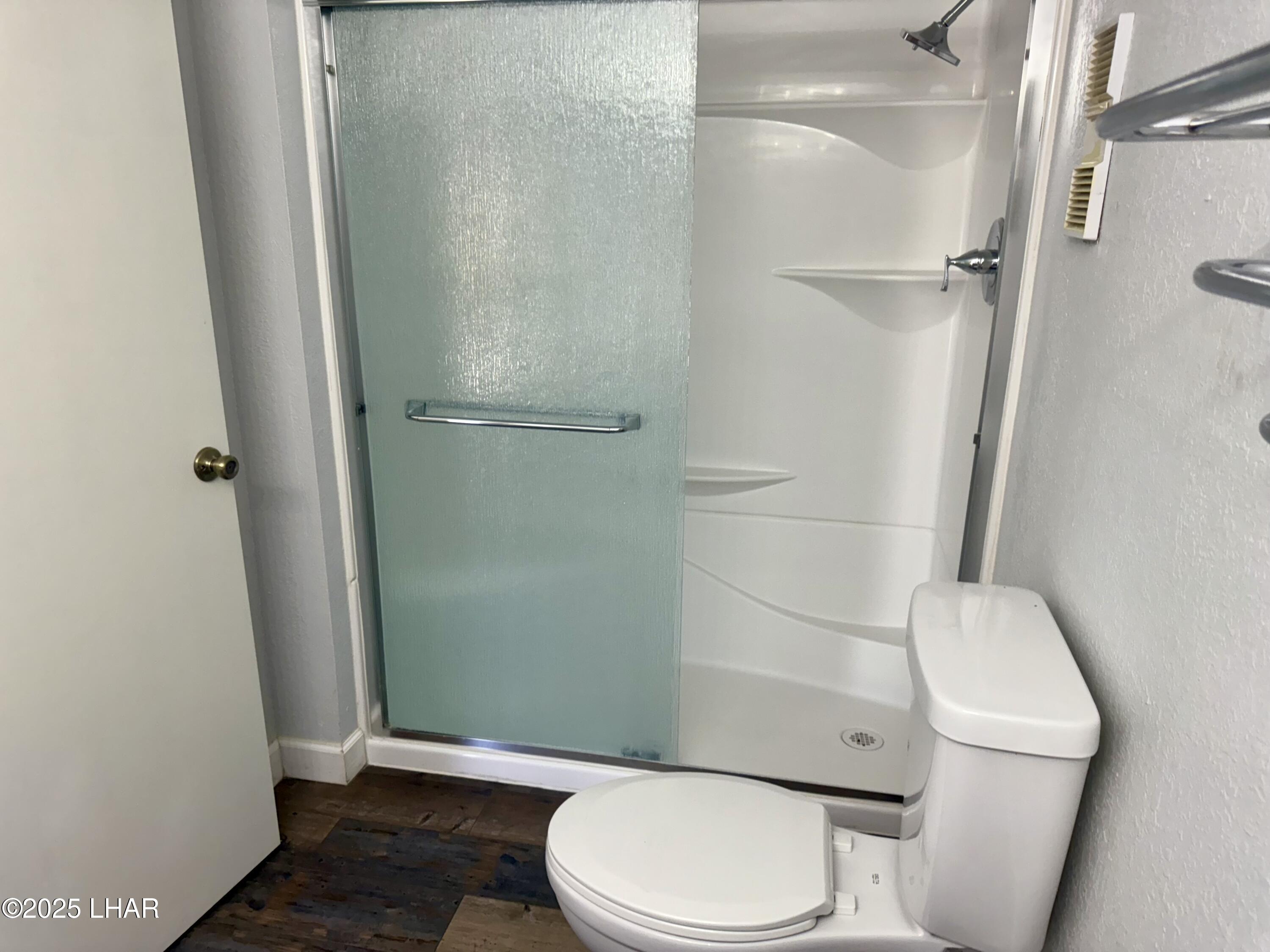 8625 Riverside Drive, Unit 38 Parker, AZ 85344 - Photo 24 of 48 a white toilet sitting next to a shower