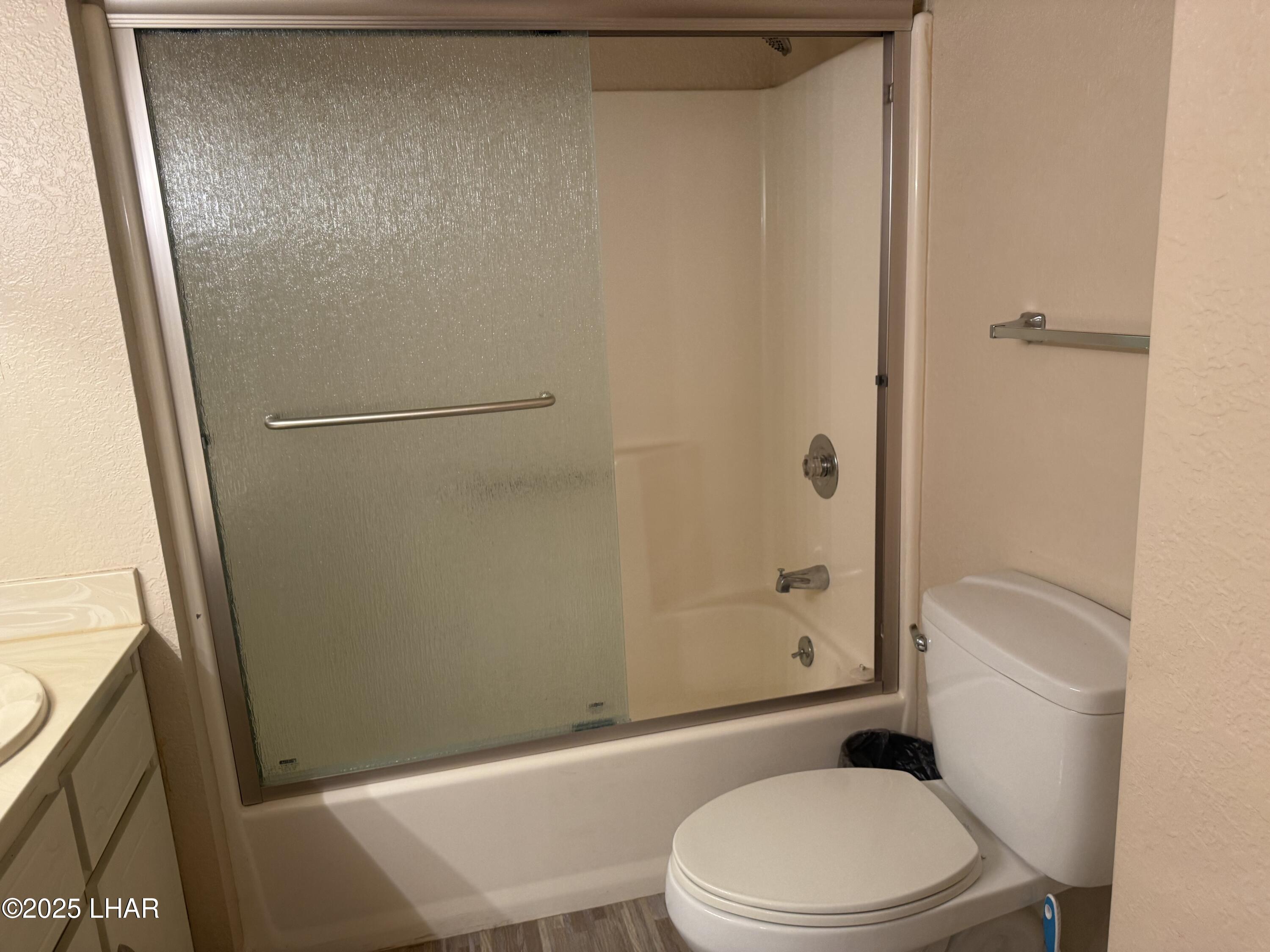 8625 Riverside Drive, Unit 38 Parker, AZ 85344 - Photo 30 of 48 a white toilet sitting next to a shower