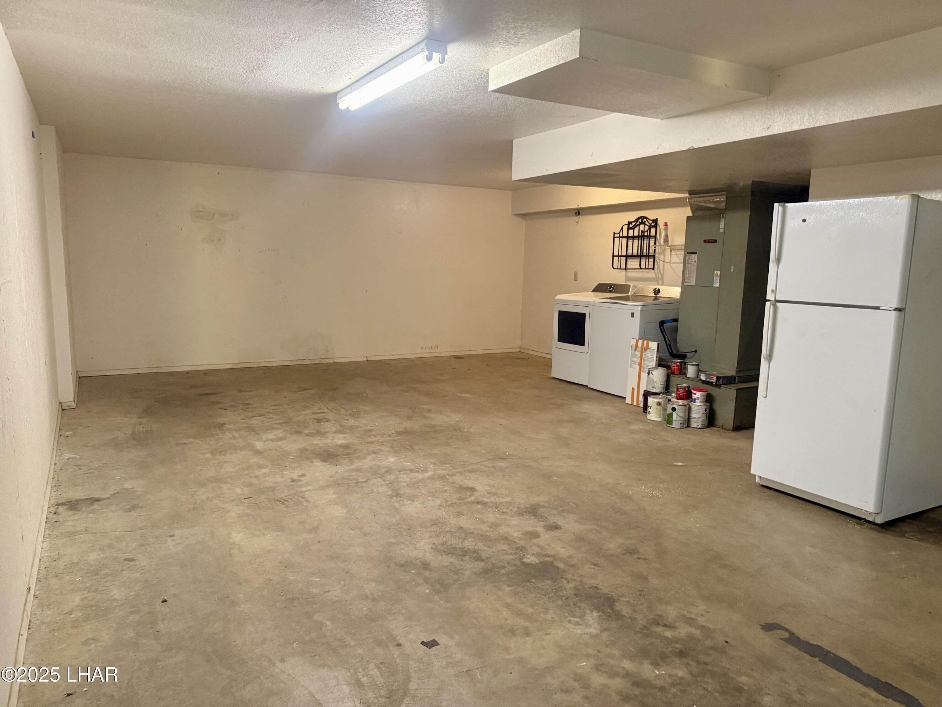 8625 Riverside Drive, Unit 38 Parker, AZ 85344 - Photo 35 of 48 a view of an empty room with a refrigerator
