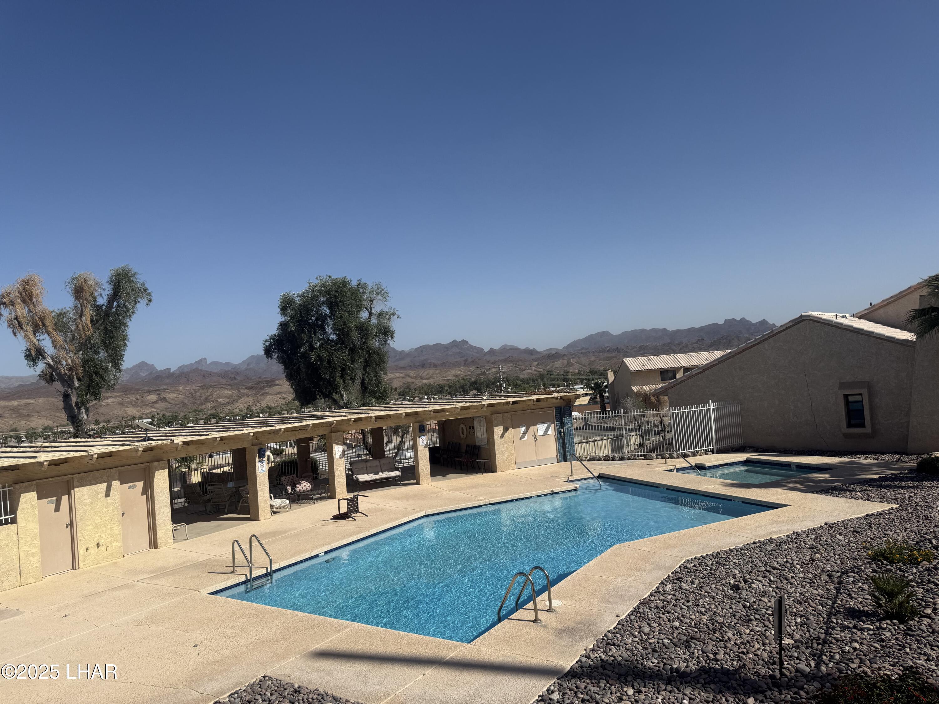 8625 Riverside Drive, Unit 38 Parker, AZ 85344 - Photo 38 of 48 a view of a house with a yard