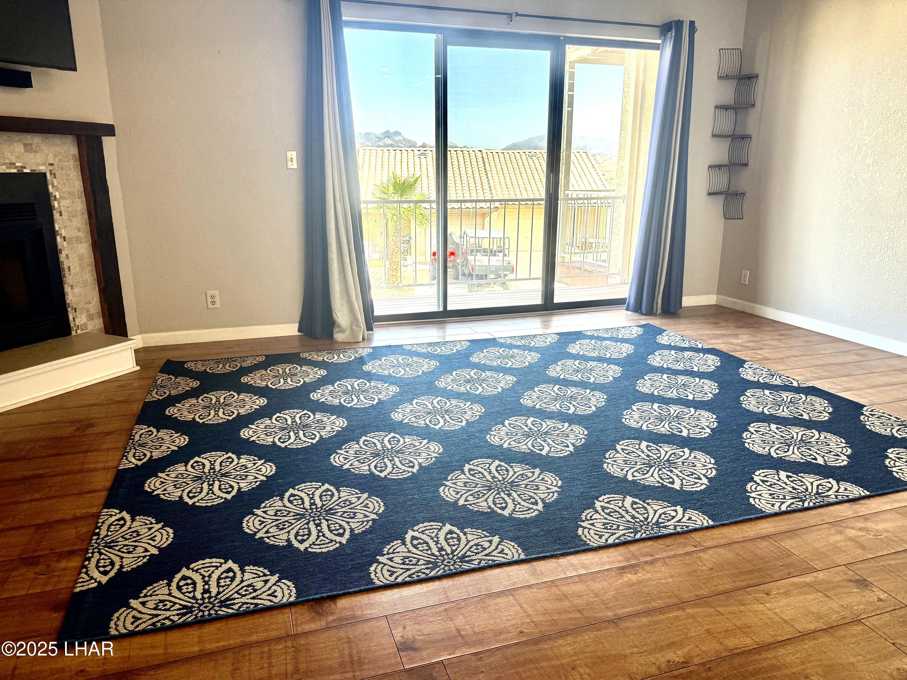 8625 Riverside Drive, Unit 38 Parker, AZ 85344 - Photo 5 of 48 a view of a bedroom with wooden floor and a rug