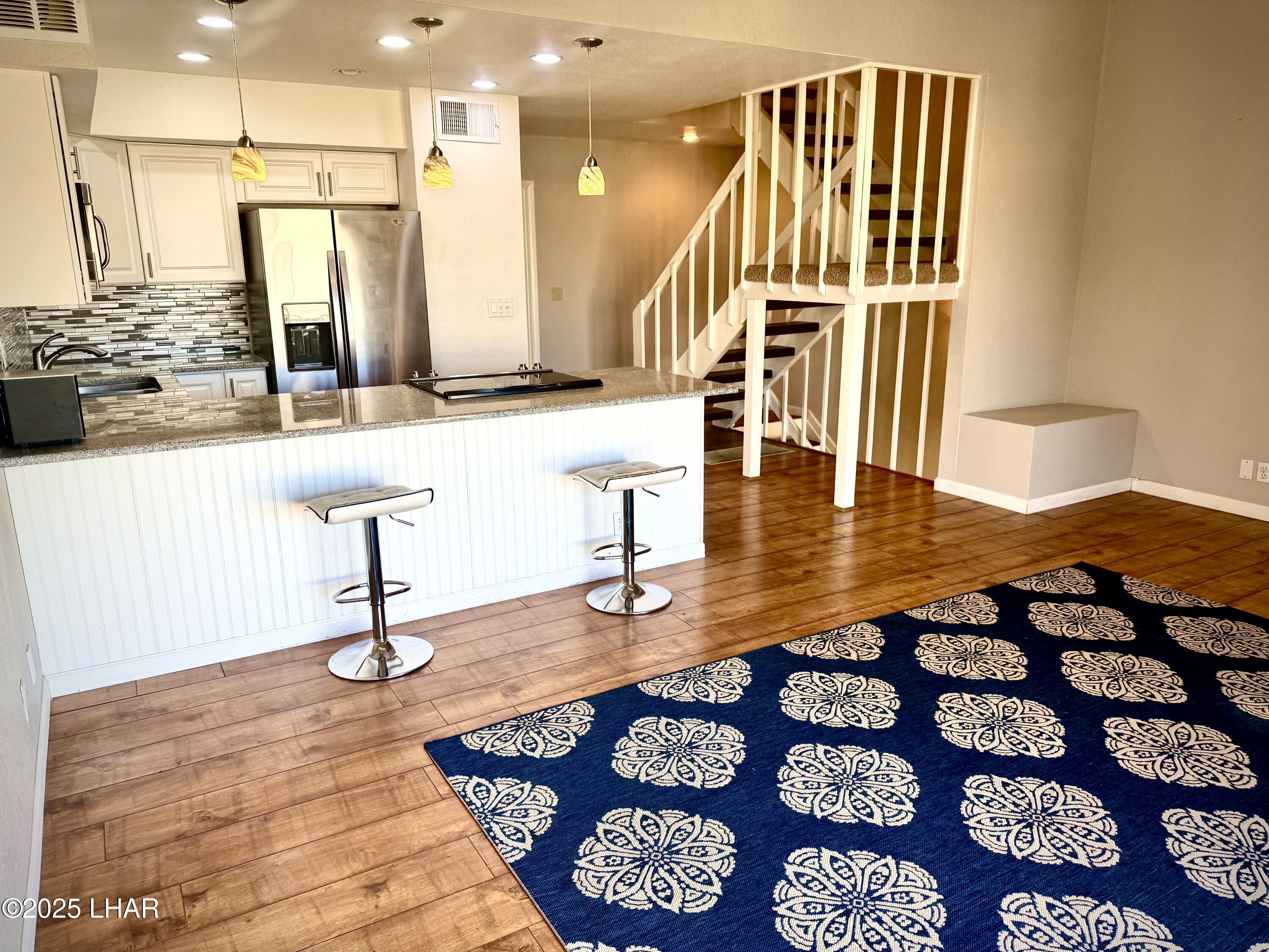 8625 Riverside Drive, Unit 38 Parker, AZ 85344 - Photo 10 of 48 a view of living room with furniture and wooden floor
