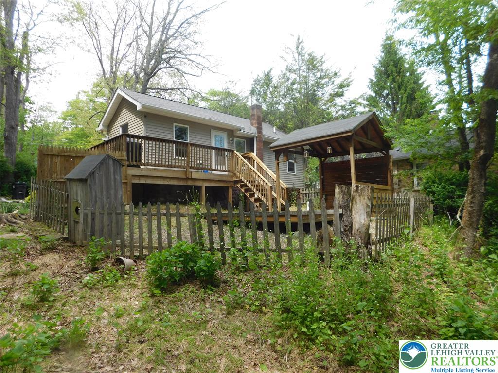 41 Reeder Street Mount Pocono, PA 18344 - Photo 2 of 41 An inviting elevated rear deck with a charming covered area for outdoor relaxation.