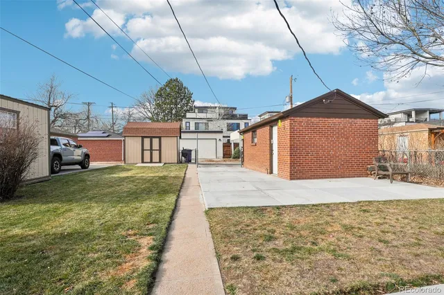 a front view of a house with a yard and a garage