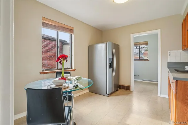 a kitchen with stainless steel appliances kitchen island granite countertop a refrigerator and a stove