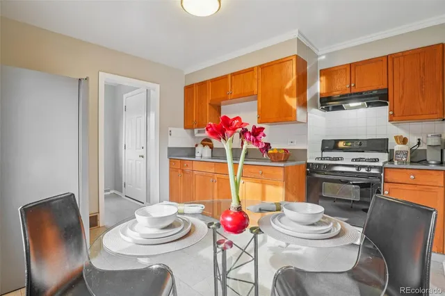a kitchen with a table and chairs