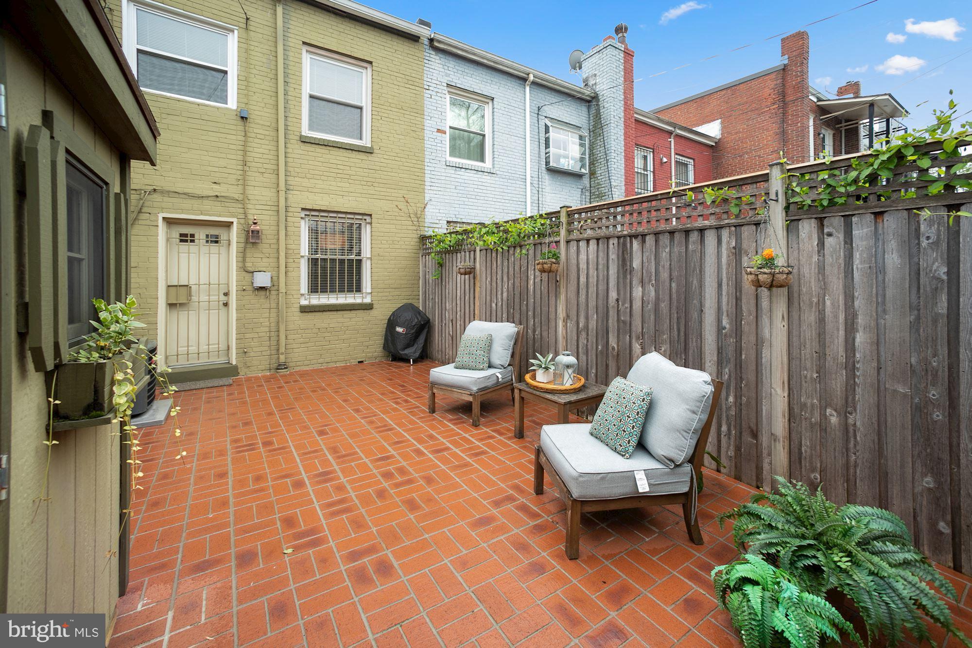 1724 E Street Northeast Washington, DC 20002 - Photo 19 of 24 Beautiful brick patio with privacy fence.