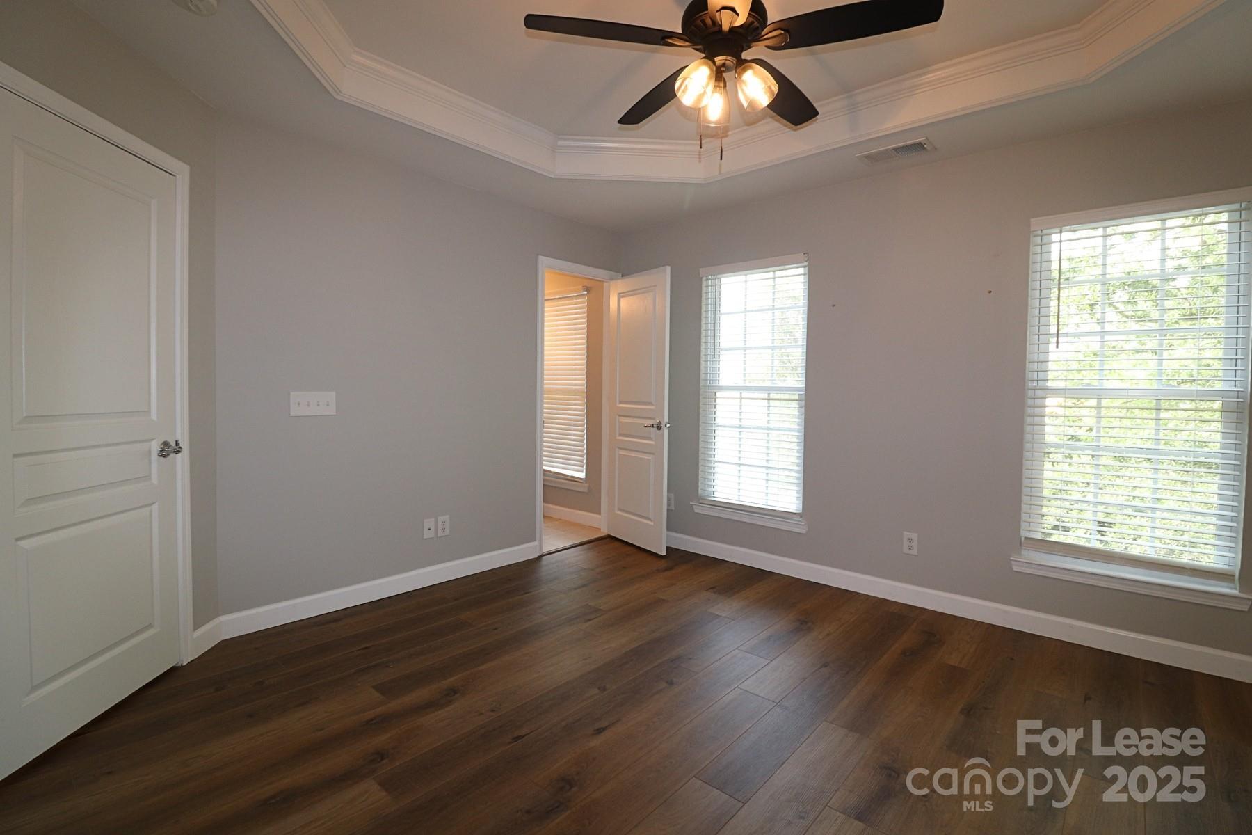 564 6th Baxter Crossing Fort Mill, SC 29708 - Photo 19 of 31 a view of an empty room with wooden floor and a window