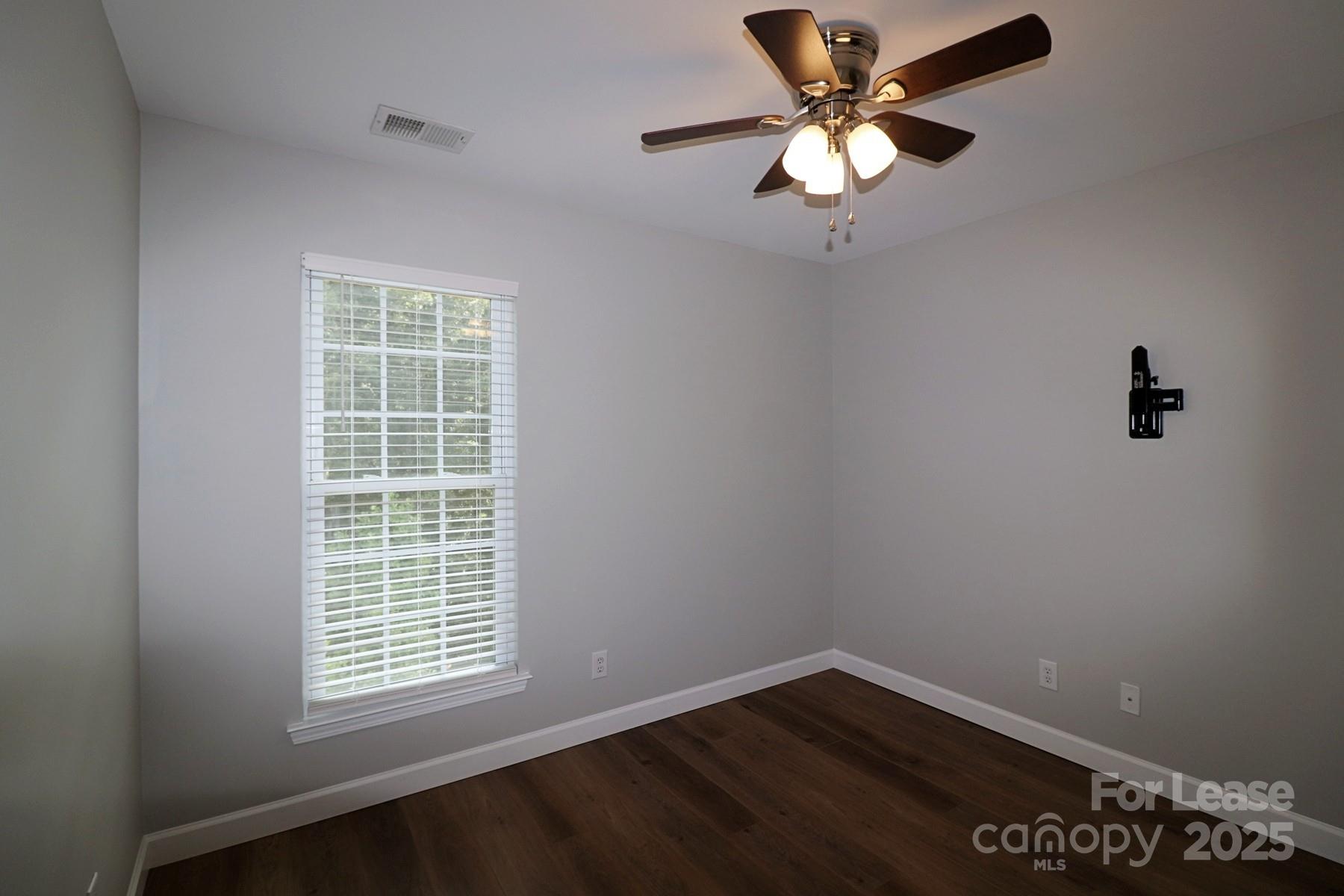 564 6th Baxter Crossing Fort Mill, SC 29708 - Photo 27 of 31 an empty room with a window and a fan