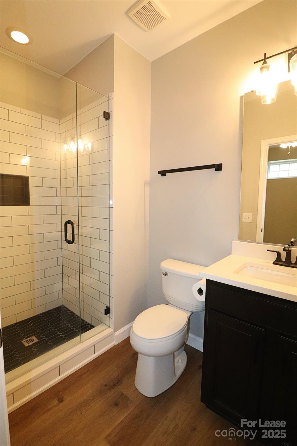 564 6th Baxter Crossing Fort Mill, SC 29708 - Photo 29 of 31 a bathroom with a sink a toilet a mirror and shower