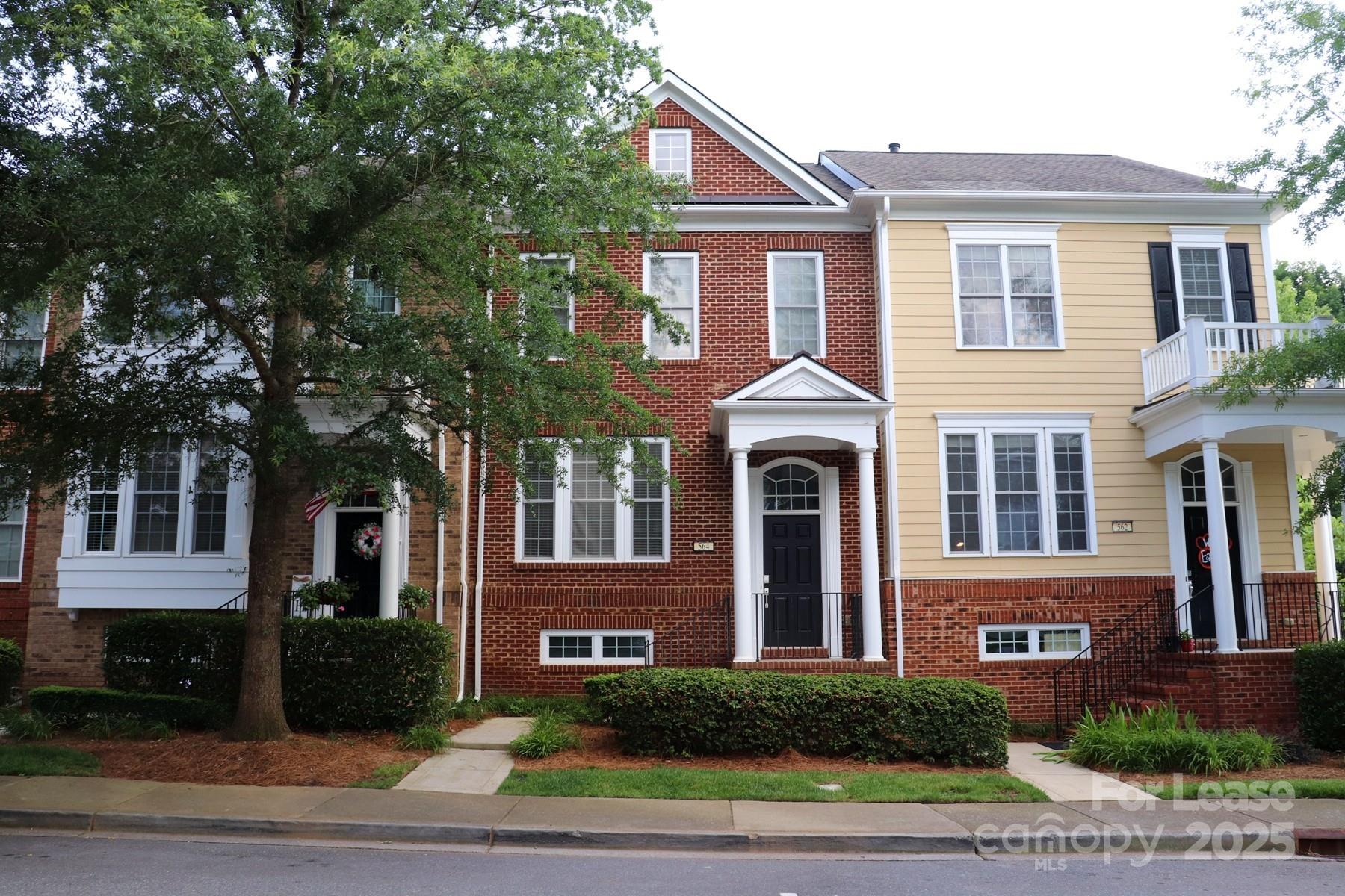 564 6th Baxter Crossing Fort Mill, SC 29708 - Photo 3 of 31 a front view of a house with a yard