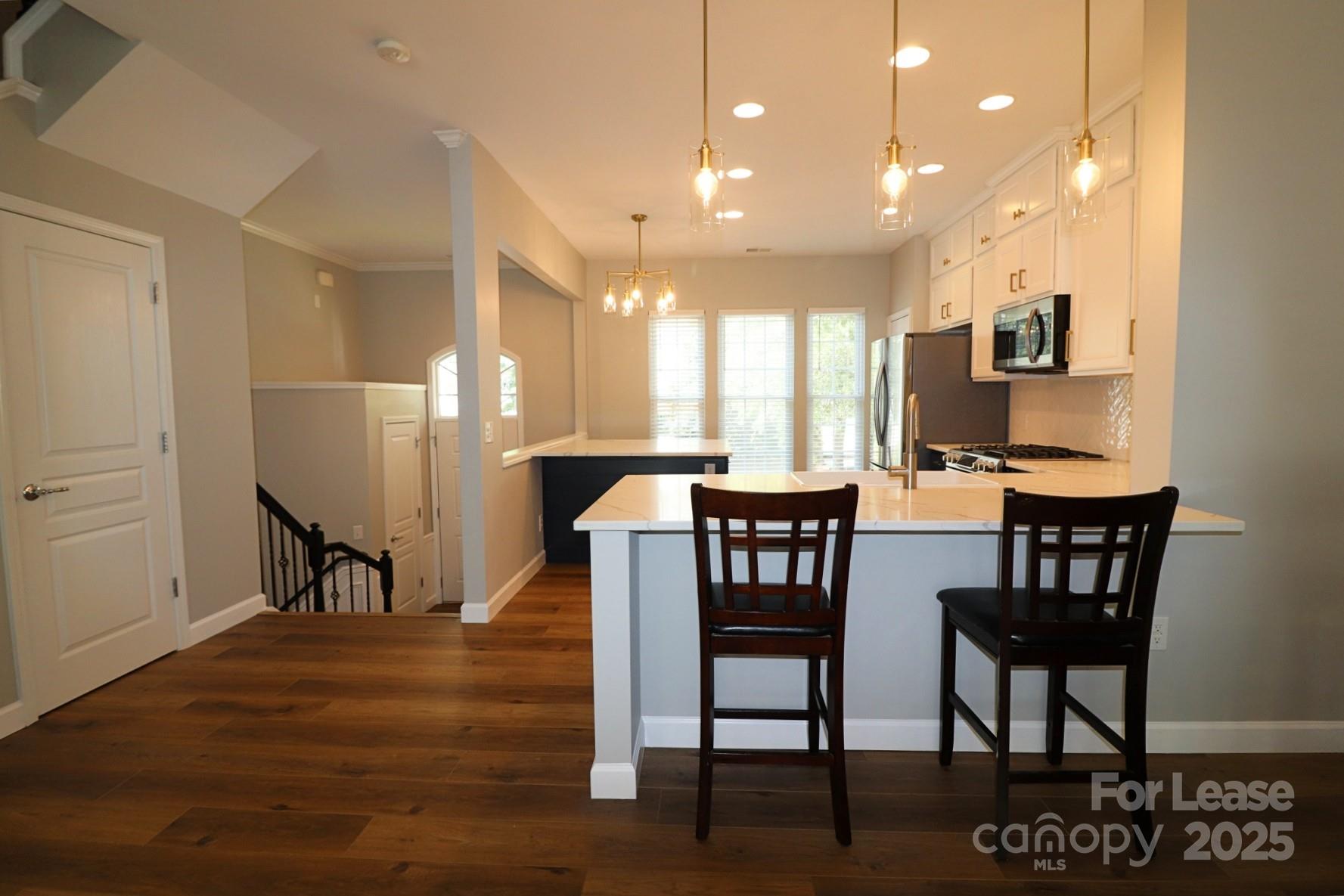 564 6th Baxter Crossing Fort Mill, SC 29708 - Photo 6 of 31 a dining room with furniture and wooden floor