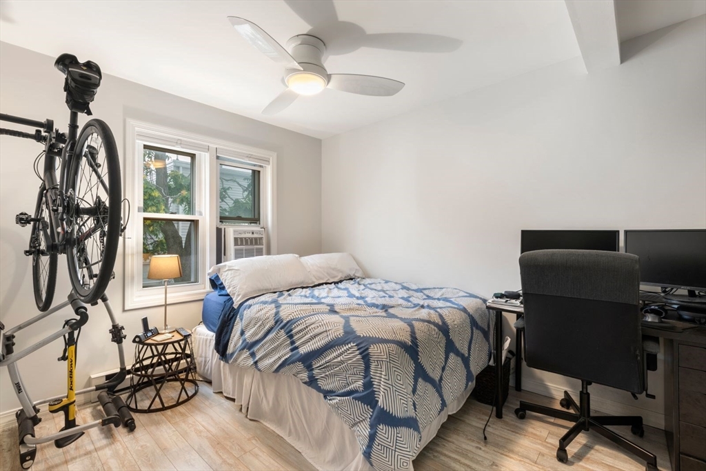 63 Bolton Street, Unit 63 Boston, MA 02127 - Photo 13 of 29 a bedroom with a bed and a desk