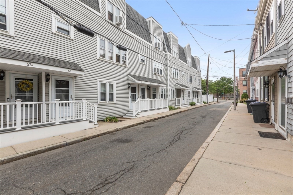 63 Bolton Street, Unit 63 Boston, MA 02127 - Photo 18 of 29 a view of a building with a street