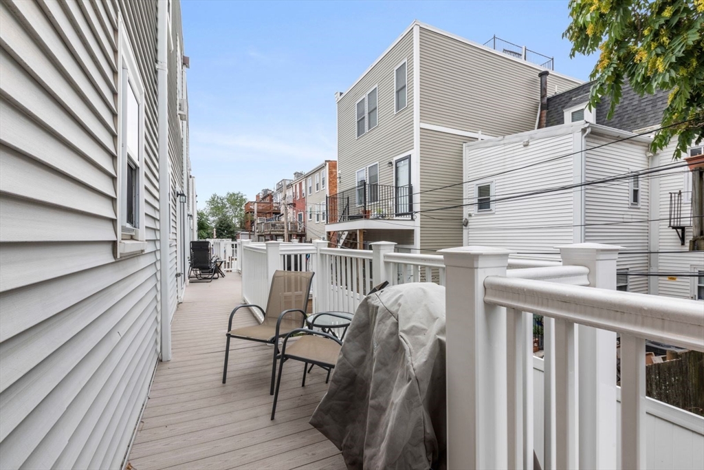 63 Bolton Street, Unit 63 Boston, MA 02127 - Photo 27 of 29 a view of a chairs and table in the balcony