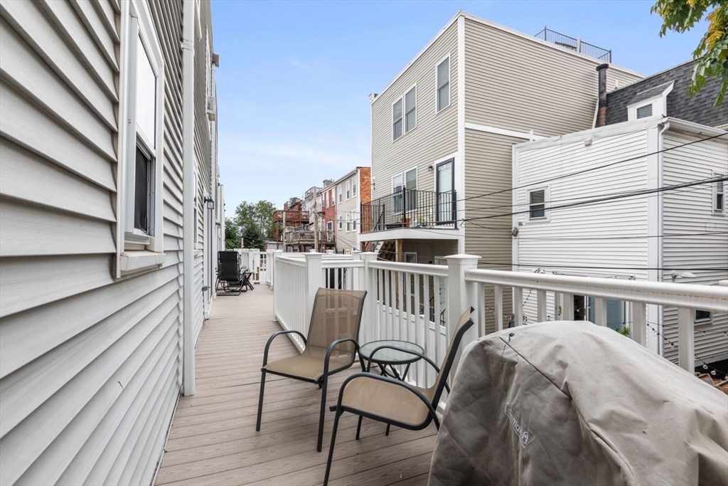 63 Bolton Street, Unit 63 Boston, MA 02127 - Photo 28 of 29 a view of a balcony with furniture