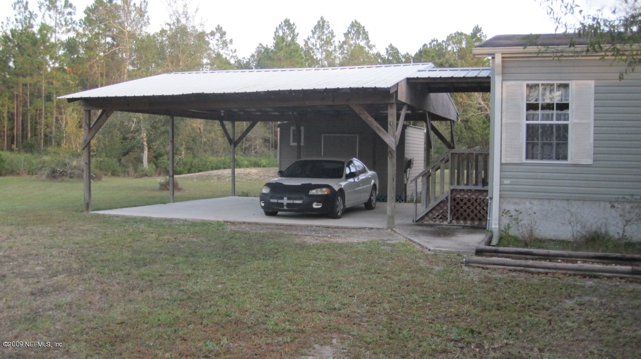 22939 Brandon Road Lawtey, FL 32058 - Photo 3 of 23 Carport w/shed