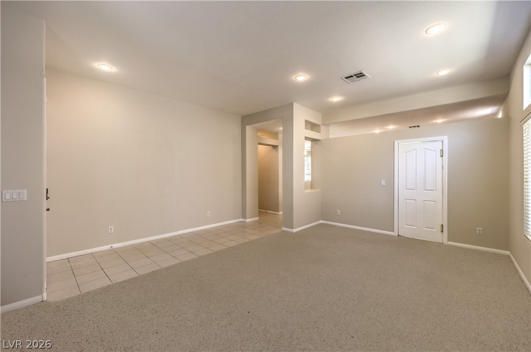 3713 Spring Shadow Road Las Vegas, NV 89129 - Photo 8 of 37 This ample living space features clean lines and a harmonious blend of carpet and tile flooring.