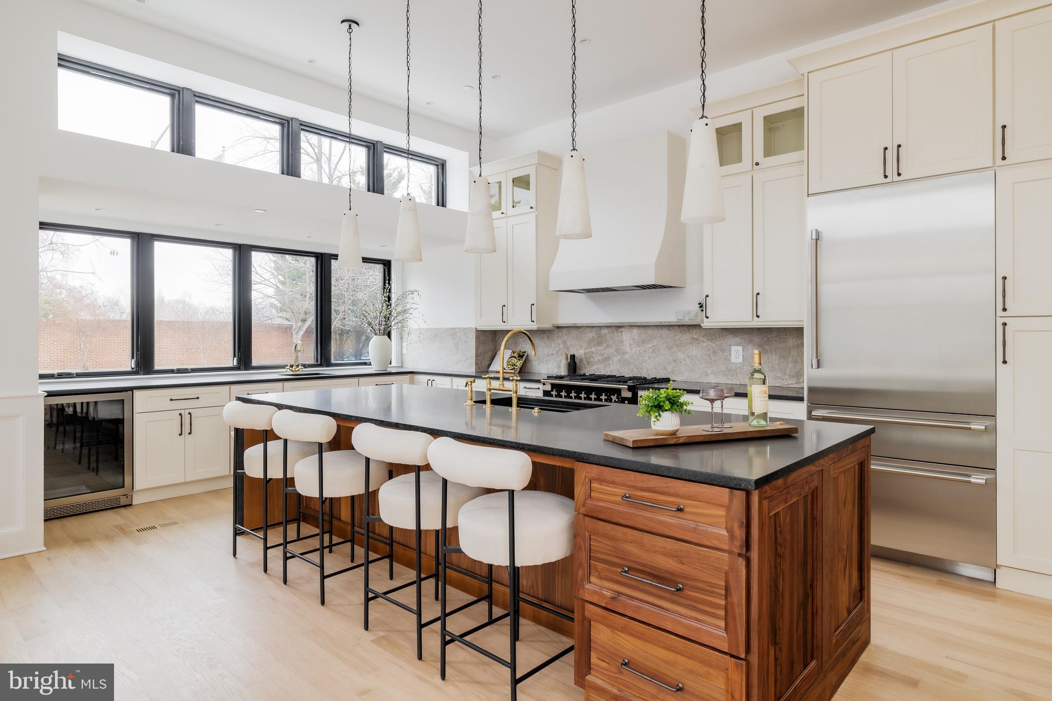 304 N Street Northwest, Unit 1 Washington, DC 20001 - Photo 12 of 47 a kitchen with stainless steel appliances granite countertop a stove a sink and a refrigerator